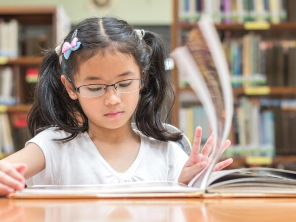 stock-photo-school-education-and-literacy-concept-with-asian-girl-kid-student-learning-and-reading-book-in-357544973